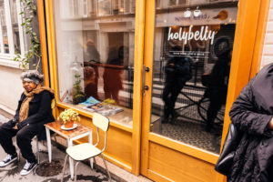 Waiting outside at Holybelly Paris