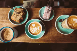 Pastries, latte and cortado flat lay at Lot Sixty One Coffee Roasters in Amsterdam