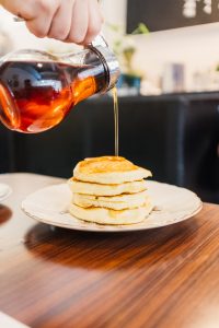 Fluffy pancakes and syrup at Millmans Restaurant - Verdun - Montreal