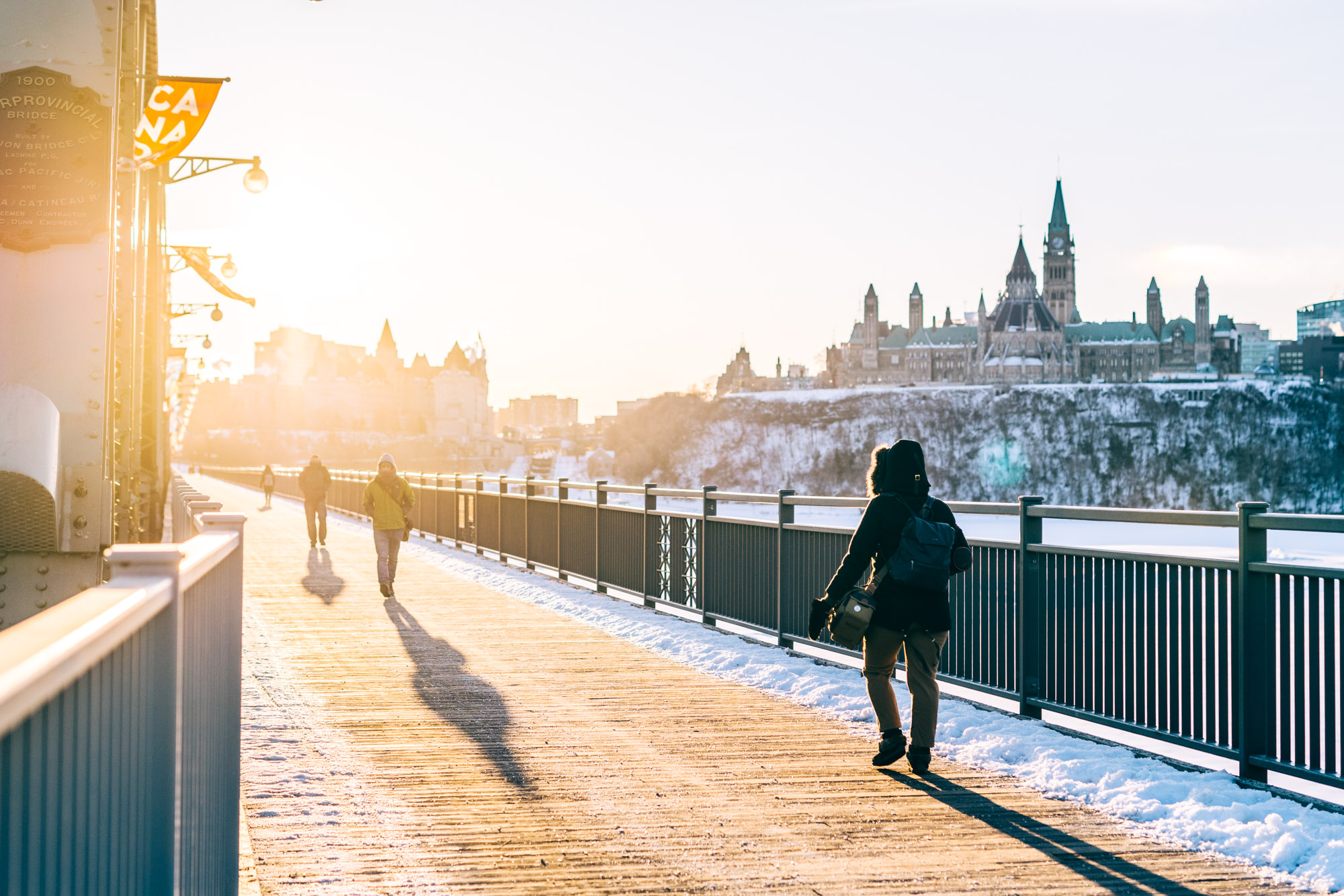 Walking on Alexandra Bridge at sunrise during winter - Ottawa Ultimate Guide For Foodies And Photographers