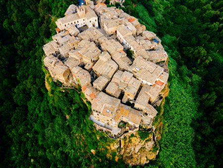 Top aerial view from Calcata Vecchia, a small medieval village that stands on a striking tuff promontory within the Valle del Treja Regional Park in Lazio, a few kilometers from Rome.